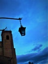 Medieval tower, street lamp and the sky