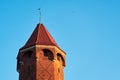 Medieval tower in sunlight against a blue sky in Gdansk, Poland. Royalty Free Stock Photo