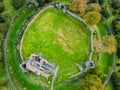 Medieval Trim Castle surrounded with green meadows ,aerial shot Royalty Free Stock Photo