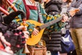 Medieval troubadour playing an antique guitar