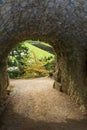 Medieval Tunnel leading to Georgian Water Garden. Royalty Free Stock Photo