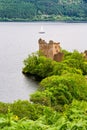 Medieval Urquhart Castle on the shore of Loch Ness on a hill overlooking the beautiful landscape, Scotland, UK. Royalty Free Stock Photo
