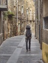 Medieval village of Castellfollit de la Roca. Woman. Girona, Spain