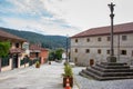 Medieval village with cross column on pilgrim`s way Camino de Santiago, Spain. Old european town with square and church. Royalty Free Stock Photo