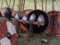 Medieval village, helmets and weapons of the Vikings, swords and shields. Royalty Free Stock Photo