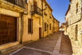 Medieval village with stone houses, cobblestone streets, old doors and windows, arches and walls. Maderuelo Segovia Spain. Europe