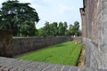 Medieval walls and external fortifications made of ancient red bricks of medieval Milan Sforza Castle. Royalty Free Stock Photo