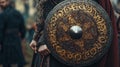 Medieval warrior holding a shield decorated with intricate patterns Royalty Free Stock Photo