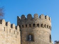 Medieval watchtower. Ancient castle palace in Baku. Castle wall and tower gate.