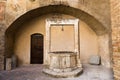 Medieval water well in Tuscany Royalty Free Stock Photo