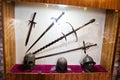 Medieval weapons or tools behind the glass in the museum.