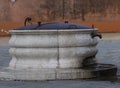 medieval well in circular form in the square