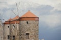 Medieval windmills of Rhodes town. Mandraki Harbour in the Dodecanese island of Rhodes Greece