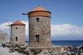 Medieval windmills of Rhodes town. Mandraki Harbour in the Dodecanese island of Rhodes Greece