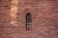 Medieval window in red brick wall Royalty Free Stock Photo