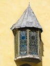 Medieval window with stained-glass, detail of old building in the Old Town Royalty Free Stock Photo