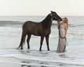 Medieval woman and horse in water Royalty Free Stock Photo