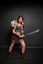 Medieval woman warrior in chain mail armor with lamellar bracers and lamellar shoulder pads with polar fox fur Royalty Free Stock Photo