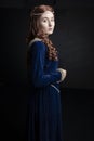 Medieval woman in a blue velvet dress Royalty Free Stock Photo