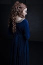 Medieval woman in a blue velvet dress Royalty Free Stock Photo