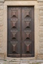 Medieval wood door with marble frame of a church in Arraiolos, Portugal