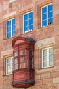 Medieval wooden balcony on a historic building in the old town of Nuremberg, Germany