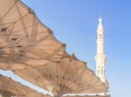 Exterior of Nabawi Mosque building and electronic umbrella in Medina Madinah. Selective focus