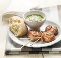 Meditarian meat skewers served with bread and pesto Royalty Free Stock Photo