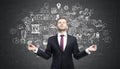 Meditating businessman wearing a red tie near chalkboard with bu