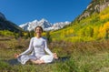 Meditating by Maroon Bells in Fall Royalty Free Stock Photo