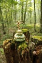 Handcrafted buddha, with moss, and painted wire tree,