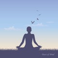 Meditating person on summer meadow at sunshine