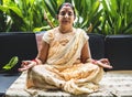 A meditating senior Indian woman