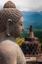 Meditating sitting Buddha sculputre sideview in Royalty Free Stock Photo