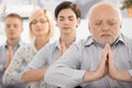 Meditating team portrait Royalty Free Stock Photo