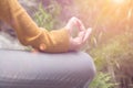 Meditating woman fingers closeup