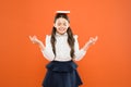 Meditation. Girl child hold book. School girl studying textbook. Kid school uniform hold book. Excited about knowledge Royalty Free Stock Photo