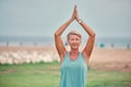 Meditation, outdoor and senior woman doing a yoga exercise for mind, body and spiritual balance. Wellness, health and Royalty Free Stock Photo