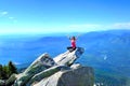 Meditation on rock with mountains and valley views. Mount Pilchuck. Seattle. Washington. United States. Royalty Free Stock Photo