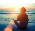 Meditation, serenity and yoga practicing at amazing sunset. Nature. Royalty Free Stock Photo