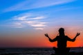 Meditation woman yoga silhouette, ocean during amazing sunset. Relax. Royalty Free Stock Photo