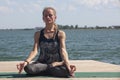 Meditation. young woman sitting in the lotus position Royalty Free Stock Photo