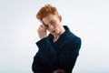 Meditative red-haired young man thinking Royalty Free Stock Photo