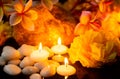 A meditative and relaxing atmosphere with candlelight, flowers and moisture