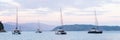 Mediterranean bay with sailing boats catamarans panoramic banner. Yachts on a sea, Corfu island, Greece. Royalty Free Stock Photo