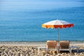 Mediterranean beach chairs and sun umbrella