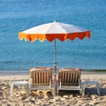 Mediterranean beach resort relaxing sunbathing chairs sun umbrella square format