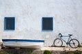 Mediterranean boat bicycle and white wall in white Royalty Free Stock Photo