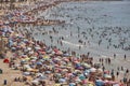 Mediterranean coastline in Spain. Calpe beach. Summer crowd. Alicante