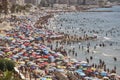 Mediterranean coastline in Spain. Calpe beach. Summer crowd. Alicante Royalty Free Stock Photo